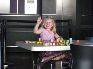 Margy took a break from looking to play with blocks.